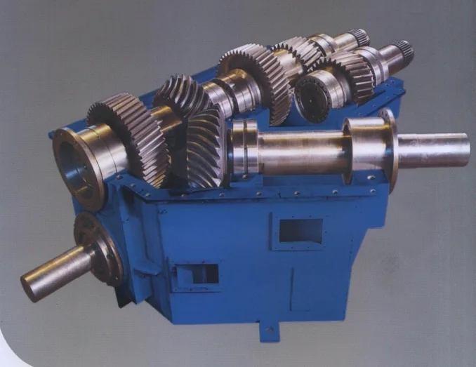 Mill gearbox opened to show the helical gear train and output shafts