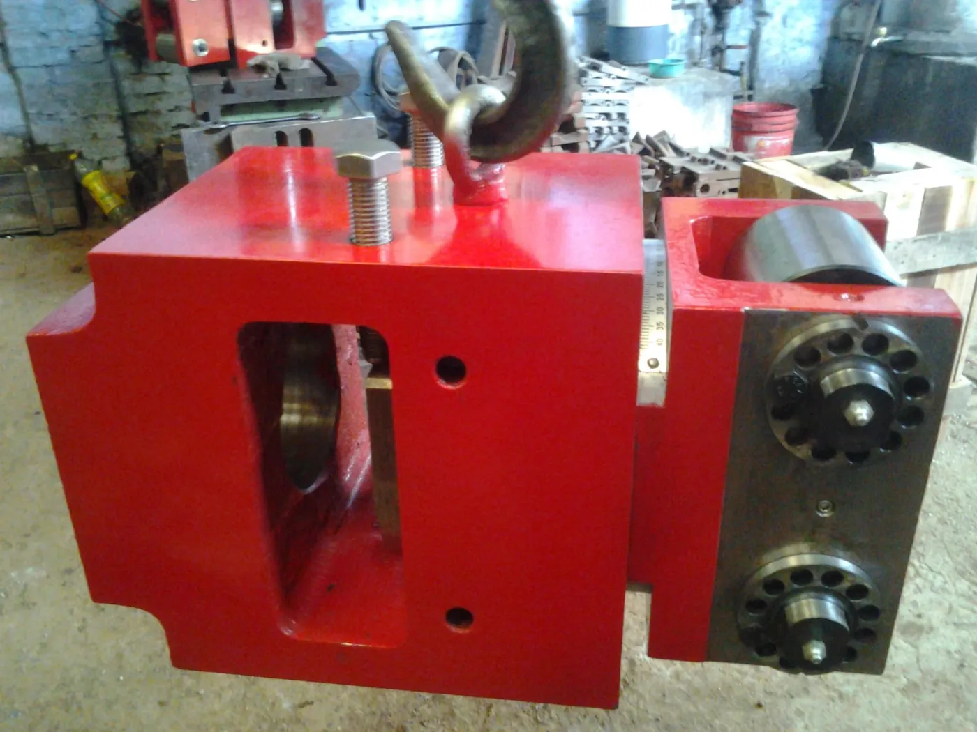 Machined block guide housing showing bore and mounting face