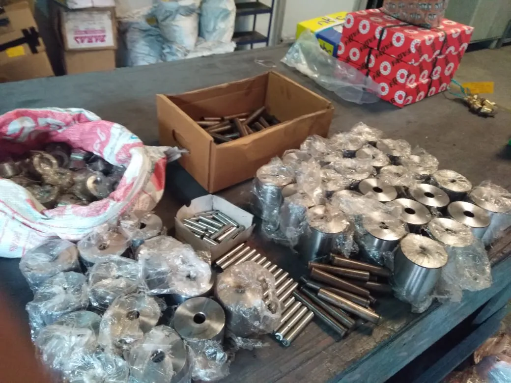 Bronze bushings, pins and mill spares on the workbench