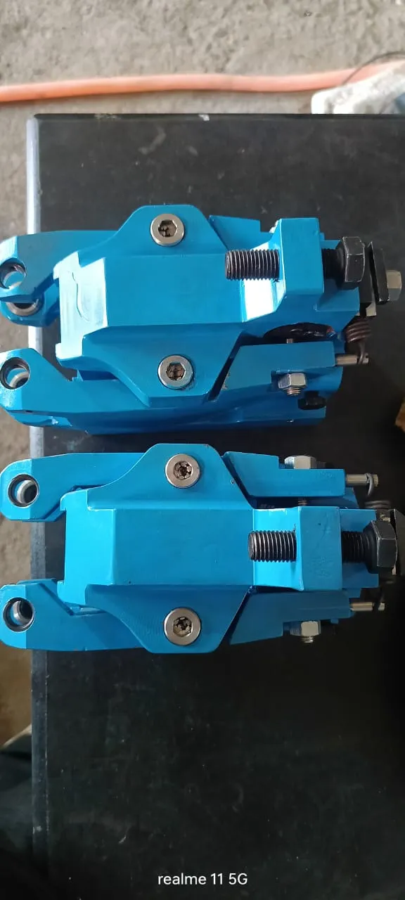 Two entry guide assemblies stacked after painting