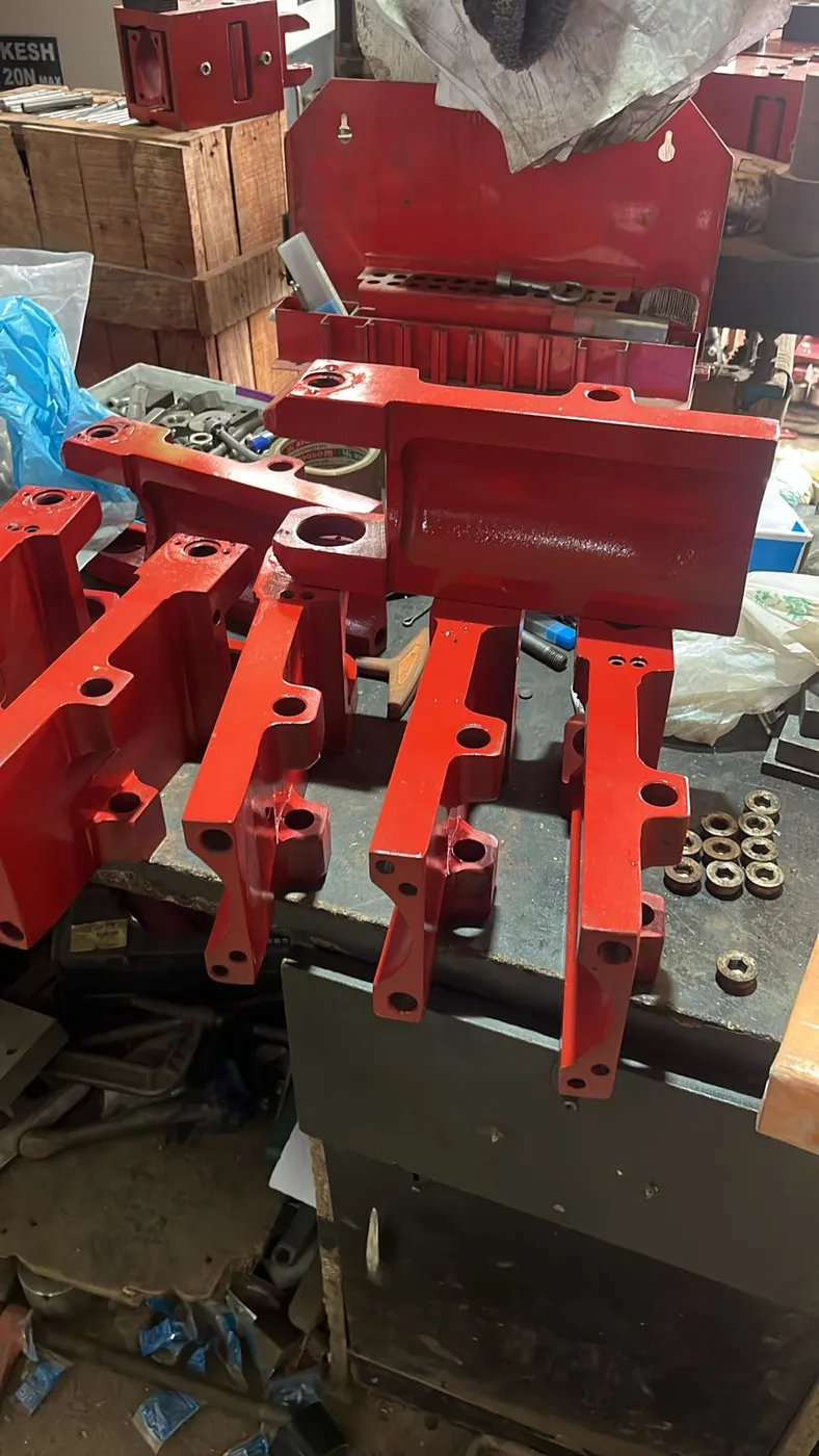 Painted lever and arm assemblies on the bench
